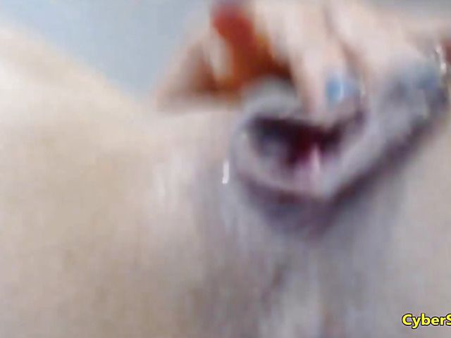 Busty amateur gives a close up of squirting pussy