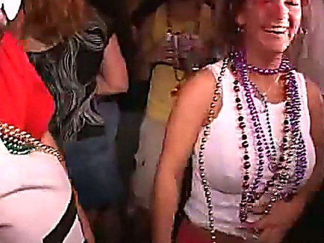 Naughty chicks show off their tits in public