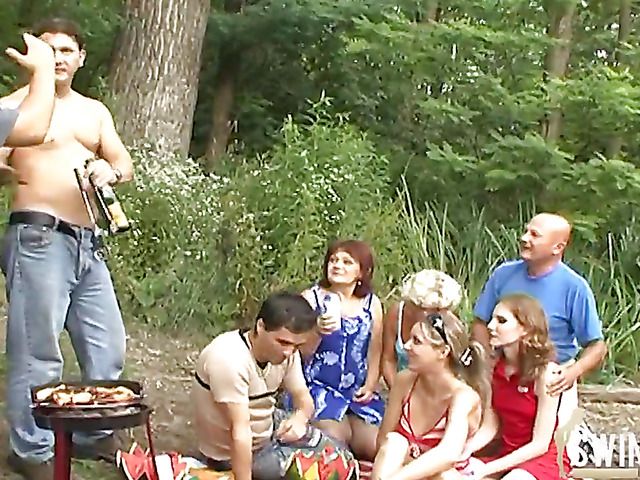 Old and young swingers party in the outdoors