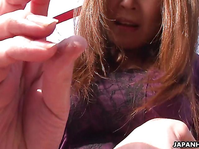 Mature Japanese pornstar Jun Kusanagi toys her twat rooftop