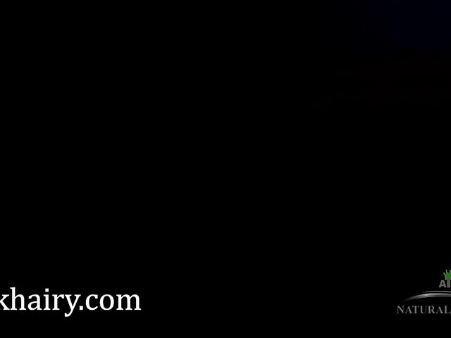 Young amateur fingers her very hairy twat