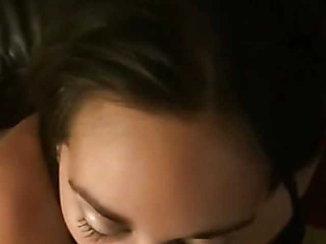 Holding the phone and spraying her face