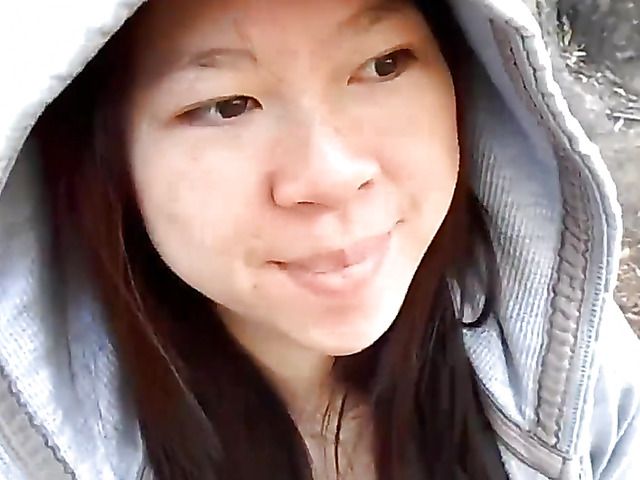 Asian girlfriend gives a public blowjob