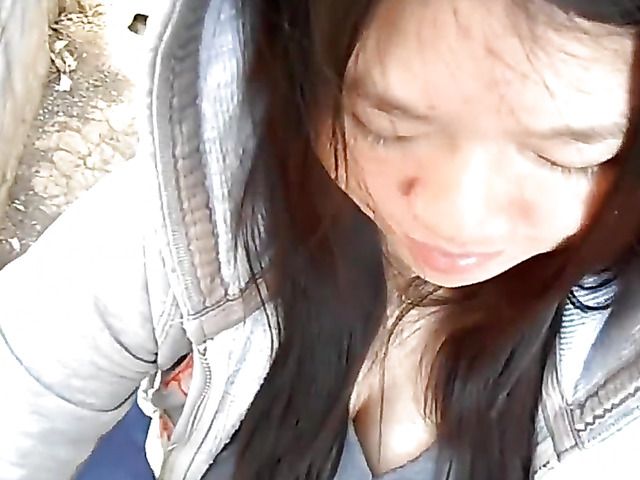 Asian girlfriend gives a public blowjob