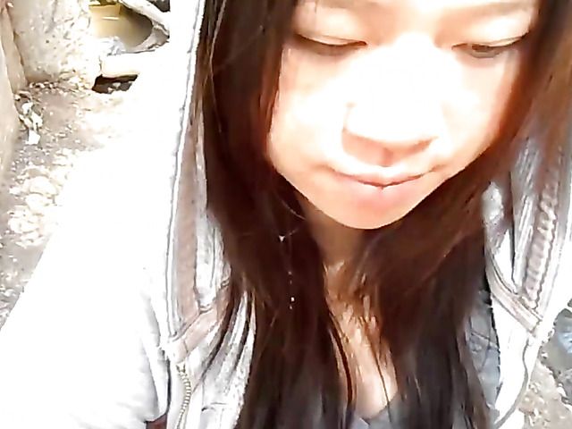 Asian girlfriend gives a public blowjob