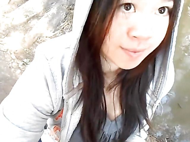 Asian girlfriend gives a public blowjob