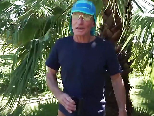 Old and young fuck under the palm tree