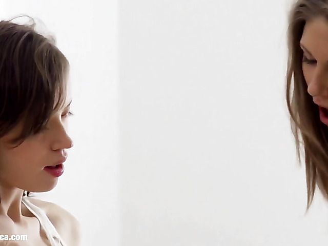 Young skinny lesbians use a dildo in bed