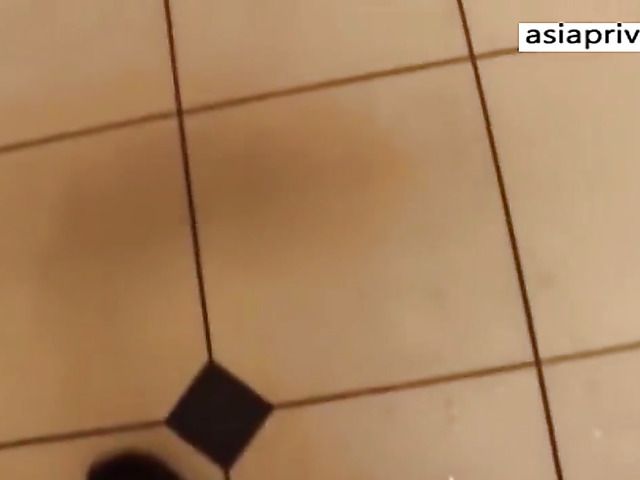 Busty Asian teen toys her slit in the public bathroom