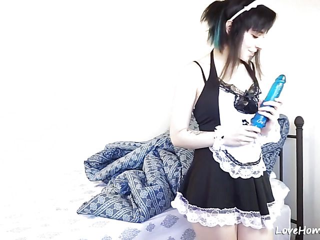 Playful maid enjoys anal masturbation on the bed