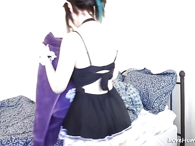 Playful maid enjoys anal masturbation on the bed