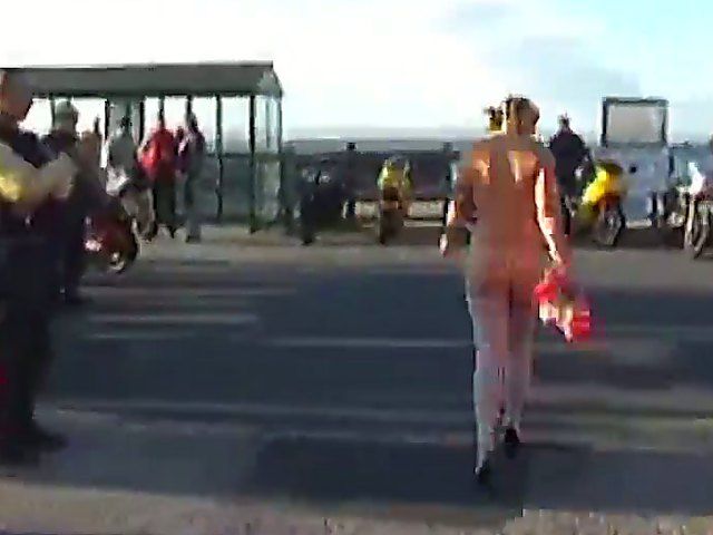 A sexy mature babe goes walking outside naked
