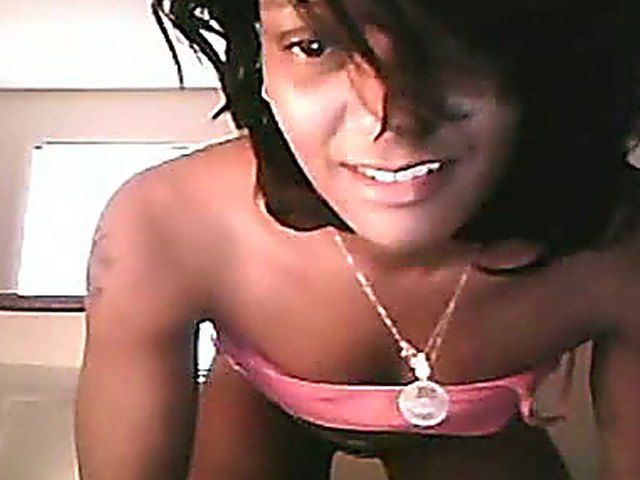 Ebony brunette stretches her ass and pussy open