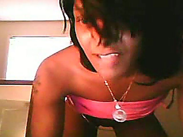 Ebony brunette stretches her ass and pussy open