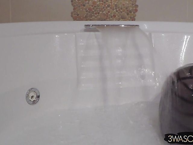 Busty Ewa Sonnet shower solo with her black dress on