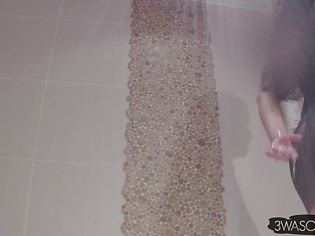 Busty Ewa Sonnet shower solo with her black dress on