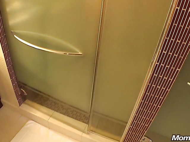 Busty mom Connie takes a shower and blows behind the scenes