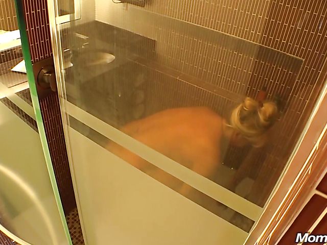 Busty mom Connie takes a shower and blows behind the scenes