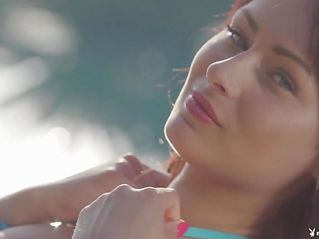 Playboy Plus model Noemi Moon shows her snatch by the pool