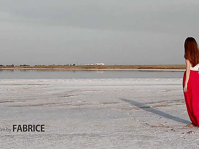 Nude teen model Nicolina posing outside