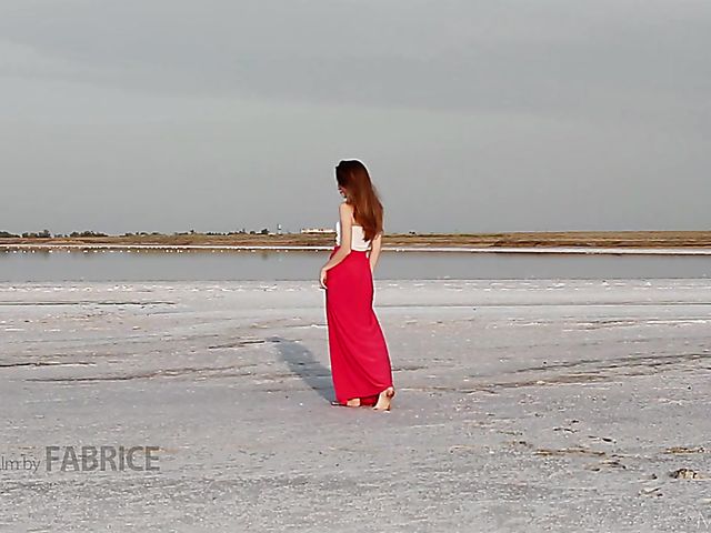 Nude teen model Nicolina posing outside