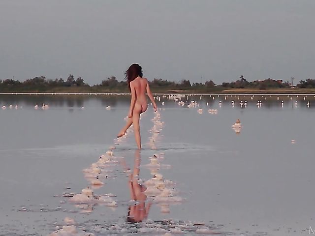 Nude teen model Nicolina posing outside