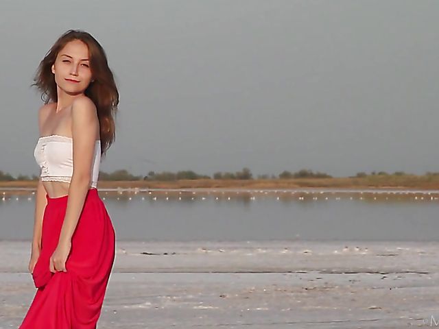 Nude teen model Nicolina posing outside