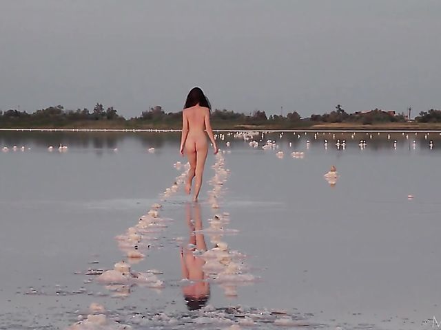 Nude teen model Nicolina posing outside