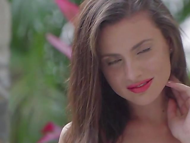 Gorgeous brunette Jasmine Jazz strips in the garden