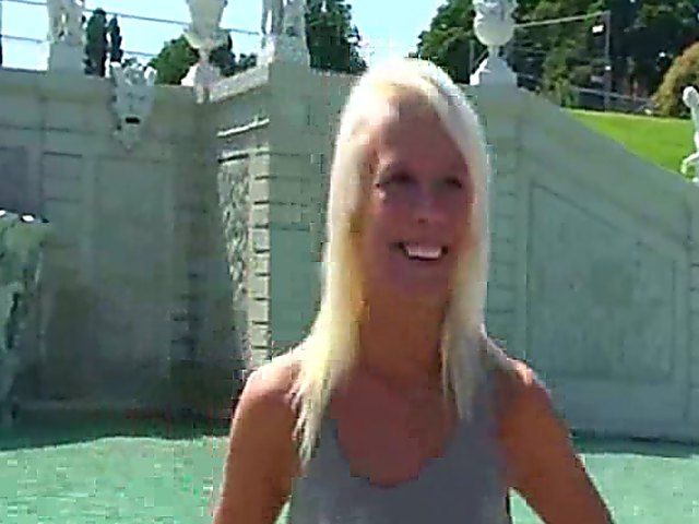 Glamorous blonde walks around outside naked in public