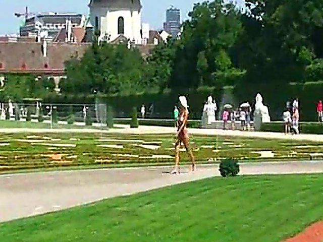 Glamorous blonde walks around outside naked in public