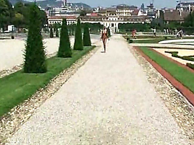 Glamorous blonde walks around outside naked in public