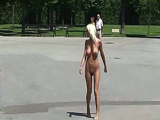 Glamorous blonde walks around outside naked in public