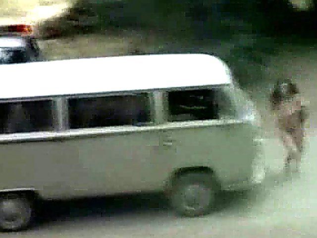 An amazing babe gets naked in the streets