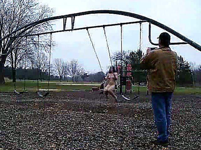 An amazing babe gets naked in the streets