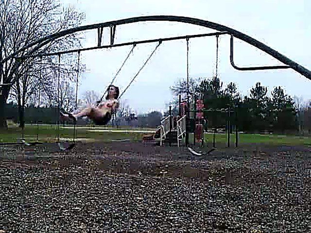 An amazing babe gets naked in the streets