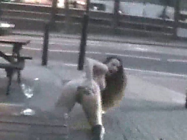 An amazing babe gets naked in the streets