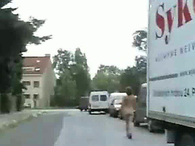 An amazing babe gets naked in the streets