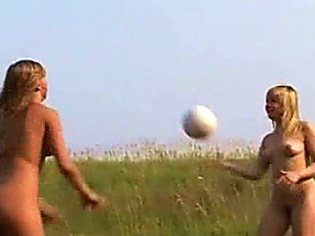 Two beautiful teen lesbians play naked outside