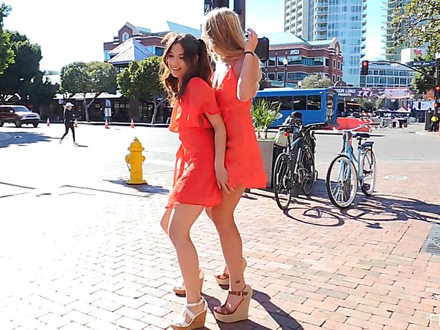 Pretty lesbian girls Melody and Harley flash in public and lick feet
