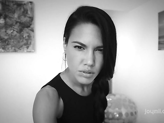 Apolonia Lapiedra solo fingering in red armchair