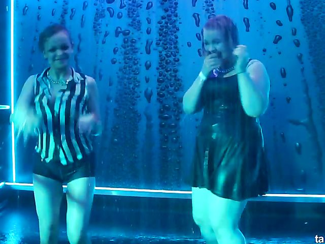 Wet drunk girls dancing at a party
