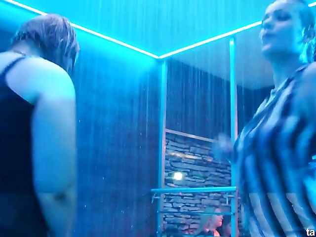 Wet drunk girls dancing at a party