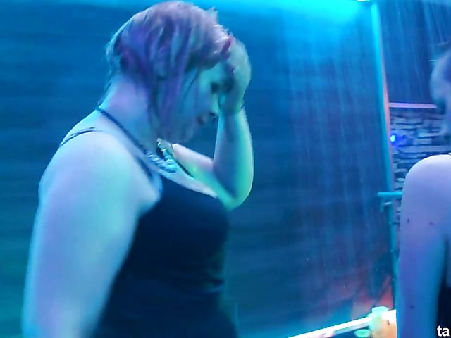 Wet drunk girls dancing at a party