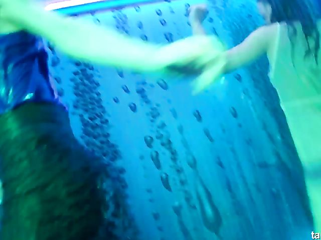 Wet drunk girls dancing at a party