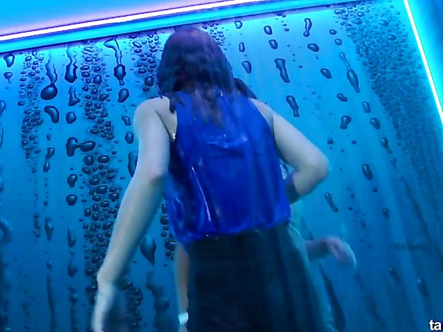 Wet drunk girls dancing at a party