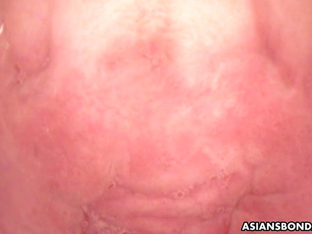 Tied up Asian sweety gets toyed by the camera dildo